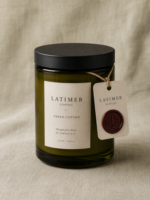 Latimer Goods Fresh Cotton Candle in olive green glass jar with ivory label and oxblood wax seal tag